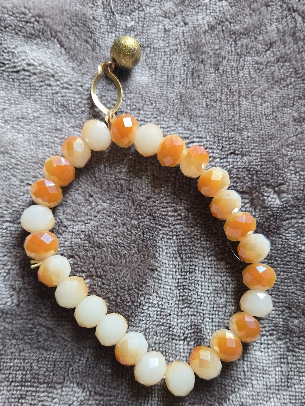 Stretchy Faceted Orange & Cream Beaded Stretch Bracelet with Gold Charm Dangle - Picture 4 of 4